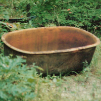 Scalding pot used to loosen the hair from a pig before curing.